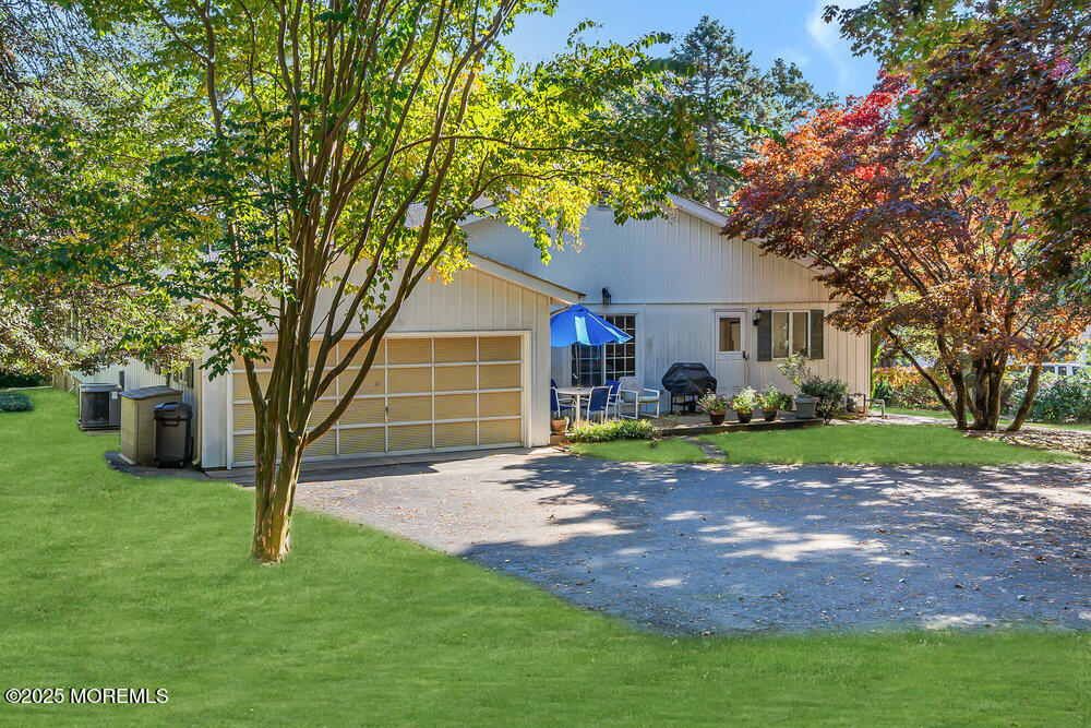 642 Rankin Road Brielle, NJ 08730 - Photo 49 of 59 a front view of a house with garden