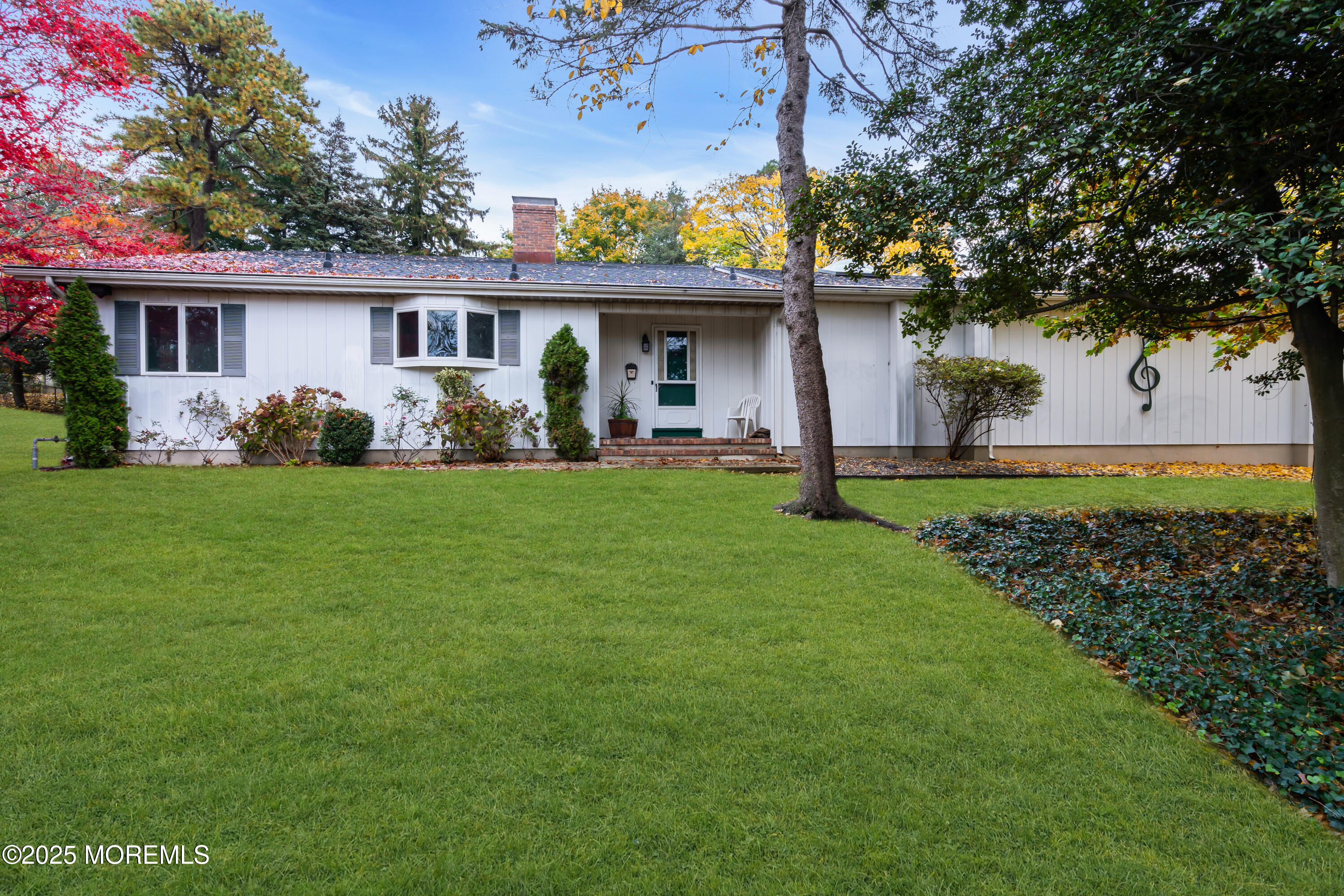 642 Rankin Road Brielle, NJ 08730 - Photo 52 of 59 a front view of house with a garden
