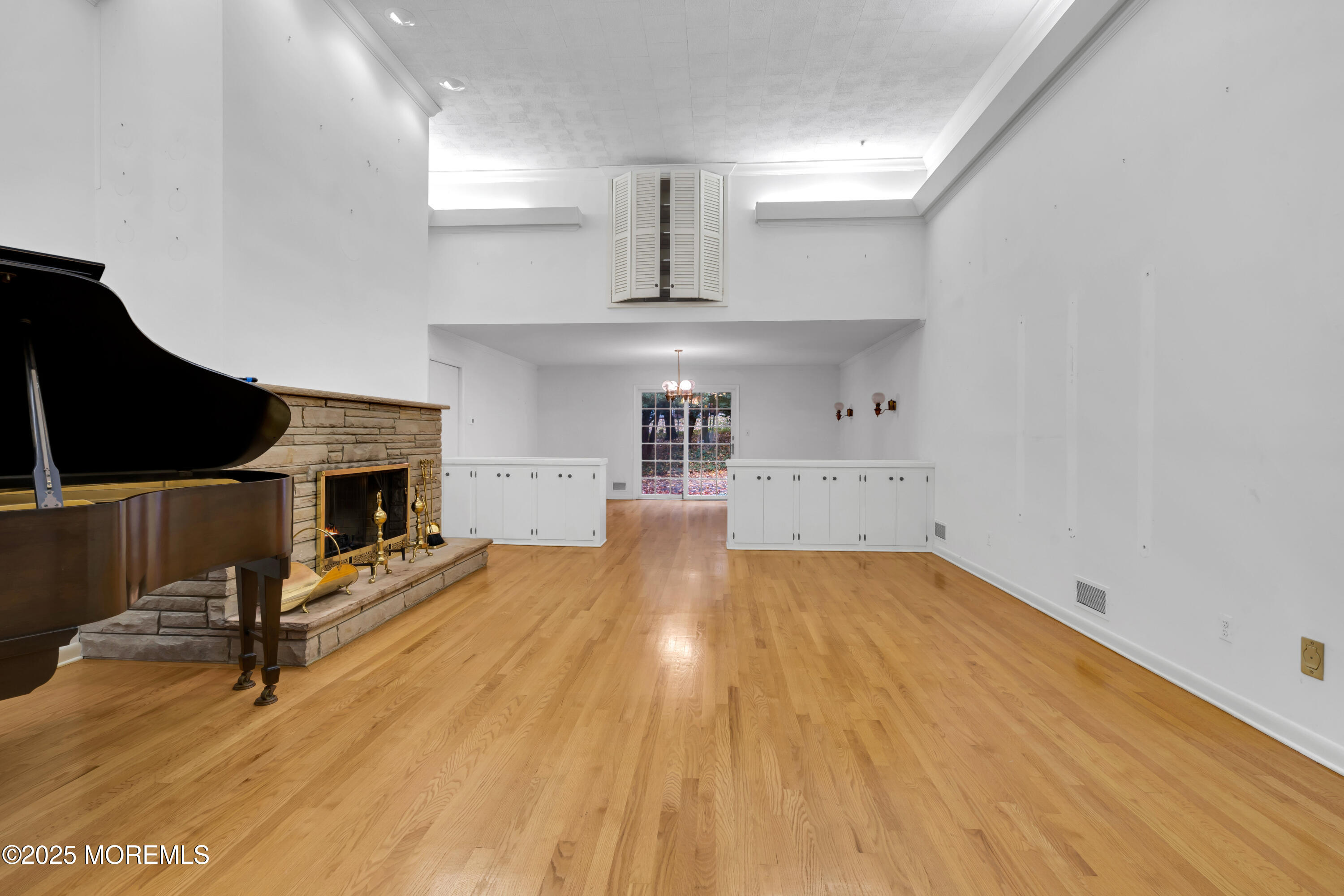 642 Rankin Road Brielle, NJ 08730 - Photo 9 of 59 a living room with hard wood floors and a fireplace