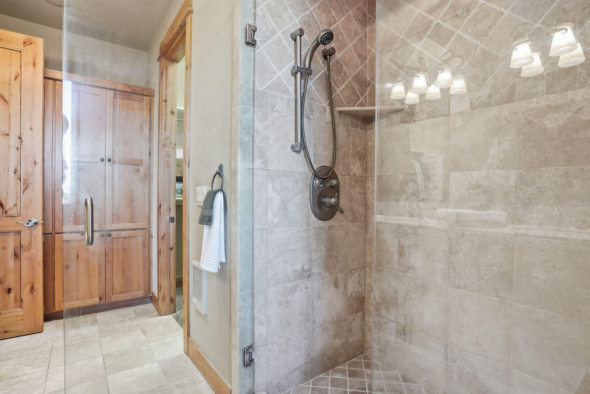 631 Sundance Ridge Court Redmond, OR 97756 - Photo 46 of 61 a bathroom with a glass shower door