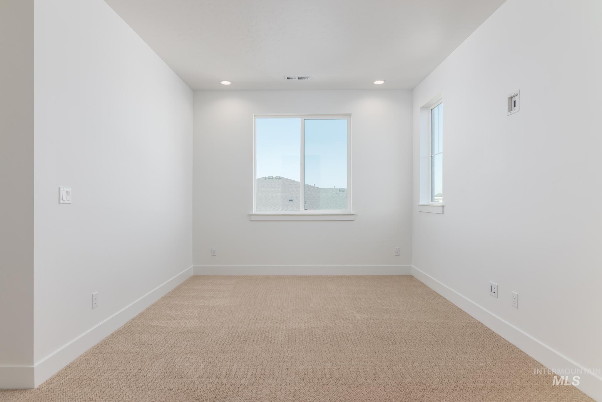 14703 Serenity Pt Street Caldwell, ID 83607 - Photo 27 of 45 Neutral-toned carpeting paired with crisp white walls