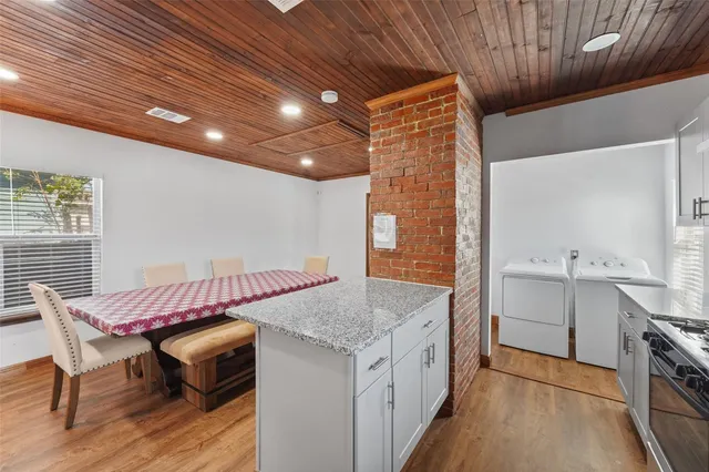 a kitchen with a stove a sink and a refrigerator