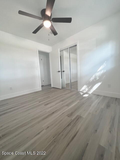 998 Cardon Drive Rockledge, FL 32955 - Photo 11 of 21 a view of empty room with wooden floor