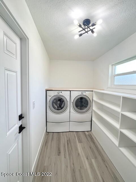 998 Cardon Drive Rockledge, FL 32955 - Photo 7 of 21 a view of a hallway with washer and dryer