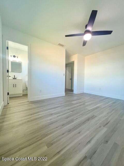 998 Cardon Drive Rockledge, FL 32955 - Photo 9 of 21 a view of a hallway with wooden floor