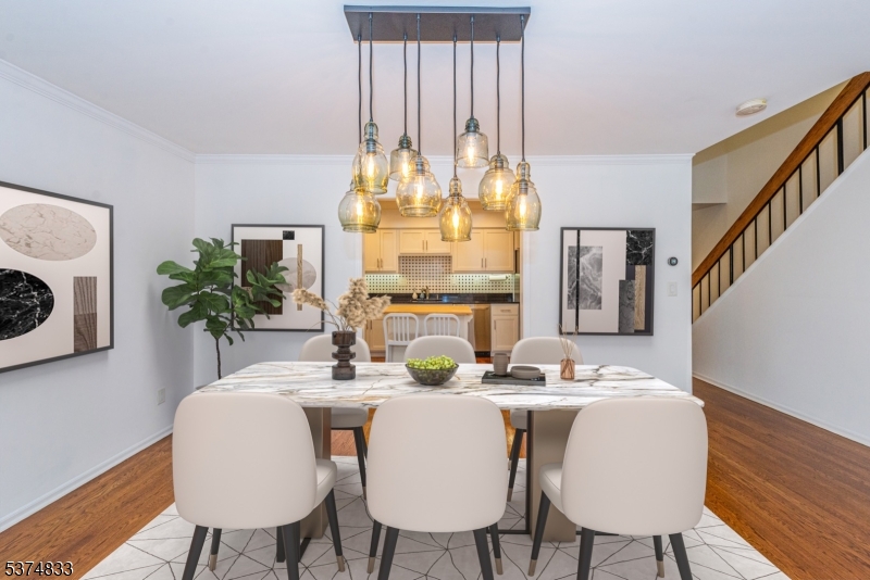 3 Avery Court Madison, NJ 07940 - Photo 12 of 50 a dining room with furniture and chandelier