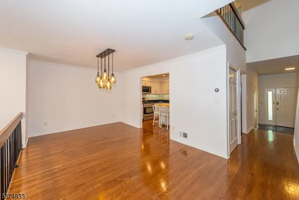 a view of hall with wooden floor
