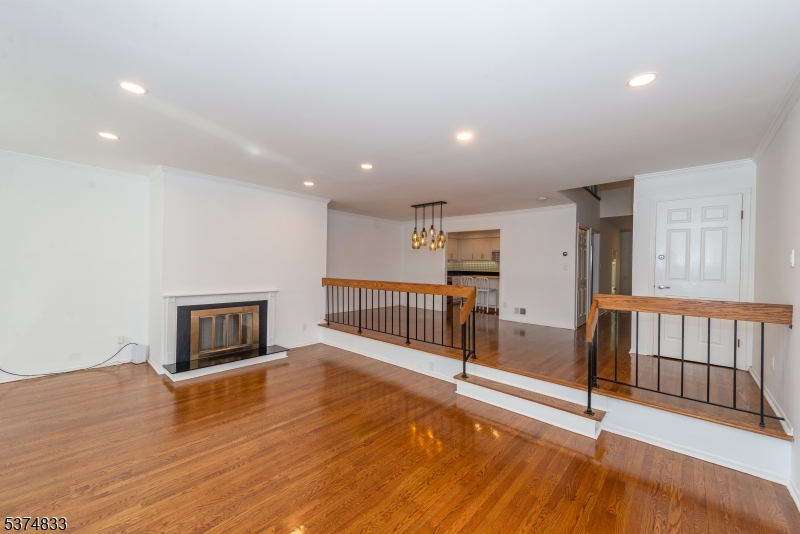 3 Avery Court Madison, NJ 07940 - Photo 21 of 50 a view of a livingroom with wooden floor and a ceiling fan