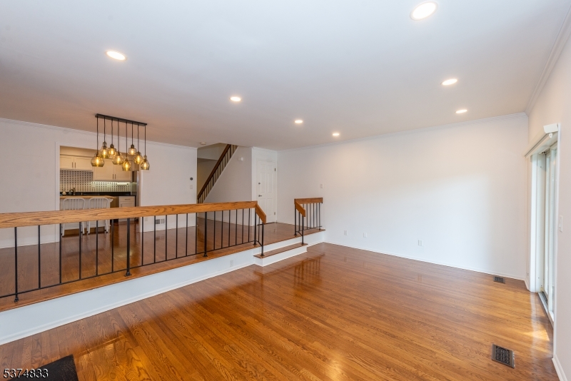 3 Avery Court Madison, NJ 07940 - Photo 24 of 50 a view of a hallway with wooden floor