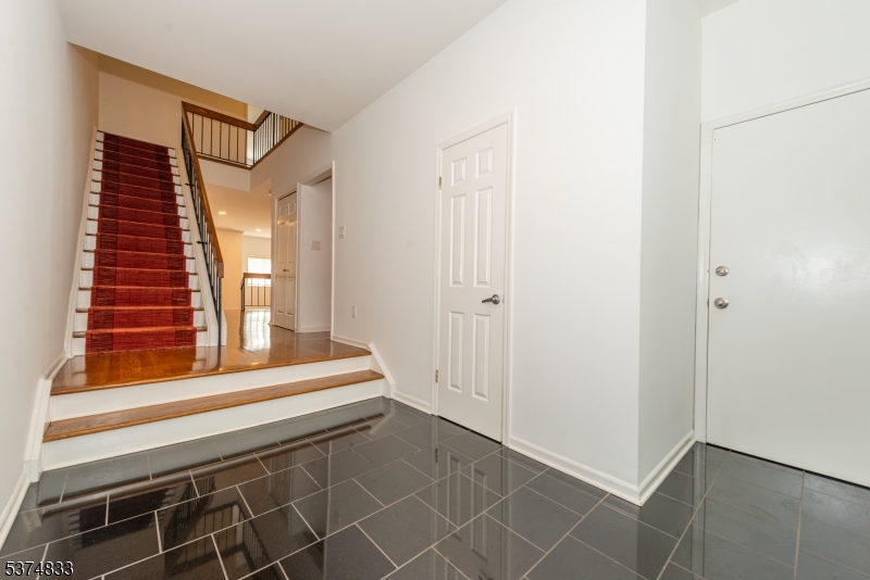 3 Avery Court Madison, NJ 07940 - Photo 3 of 50 a view of a small space with wooden floor and windows