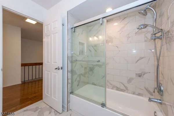 a bathroom with a granite countertop sink a toilet and a mirror