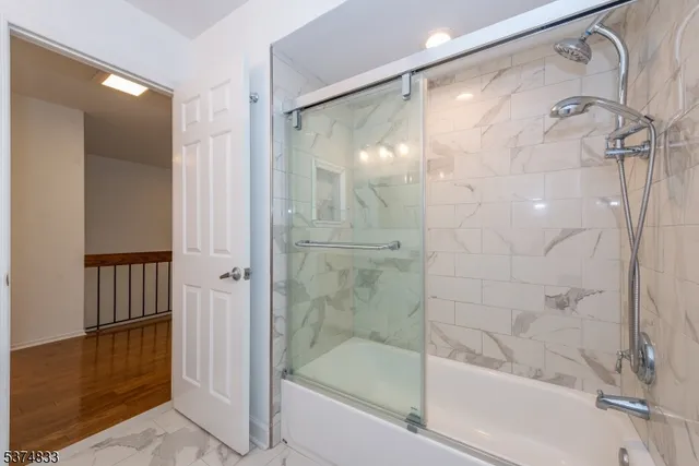 a bathroom with a granite countertop sink a toilet and a mirror
