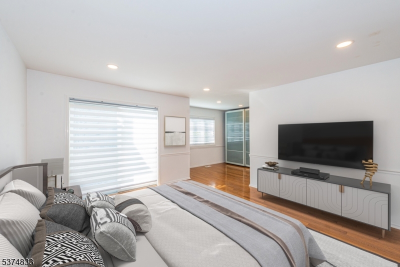 3 Avery Court Madison, NJ 07940 - Photo 36 of 50 a bedroom with a bed and a flat screen tv