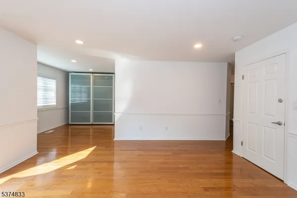 a bathroom with a shower and a glass door