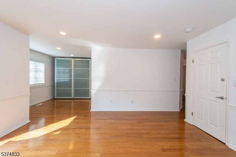 3 Avery Court Madison, NJ 07940 - Photo 39 of 50 an empty room with wooden floor and windows