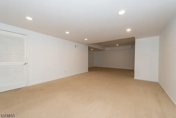 a view of an empty room with stairs