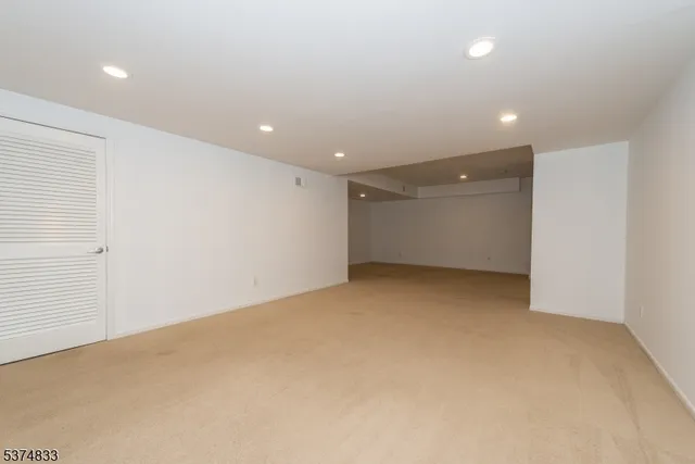 a view of an empty room with stairs