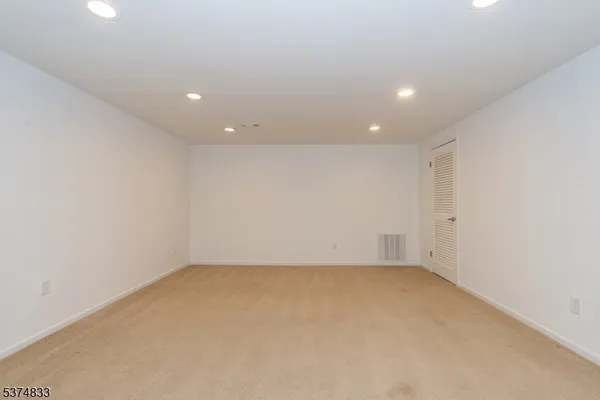 a view of a backyard with wooden fence