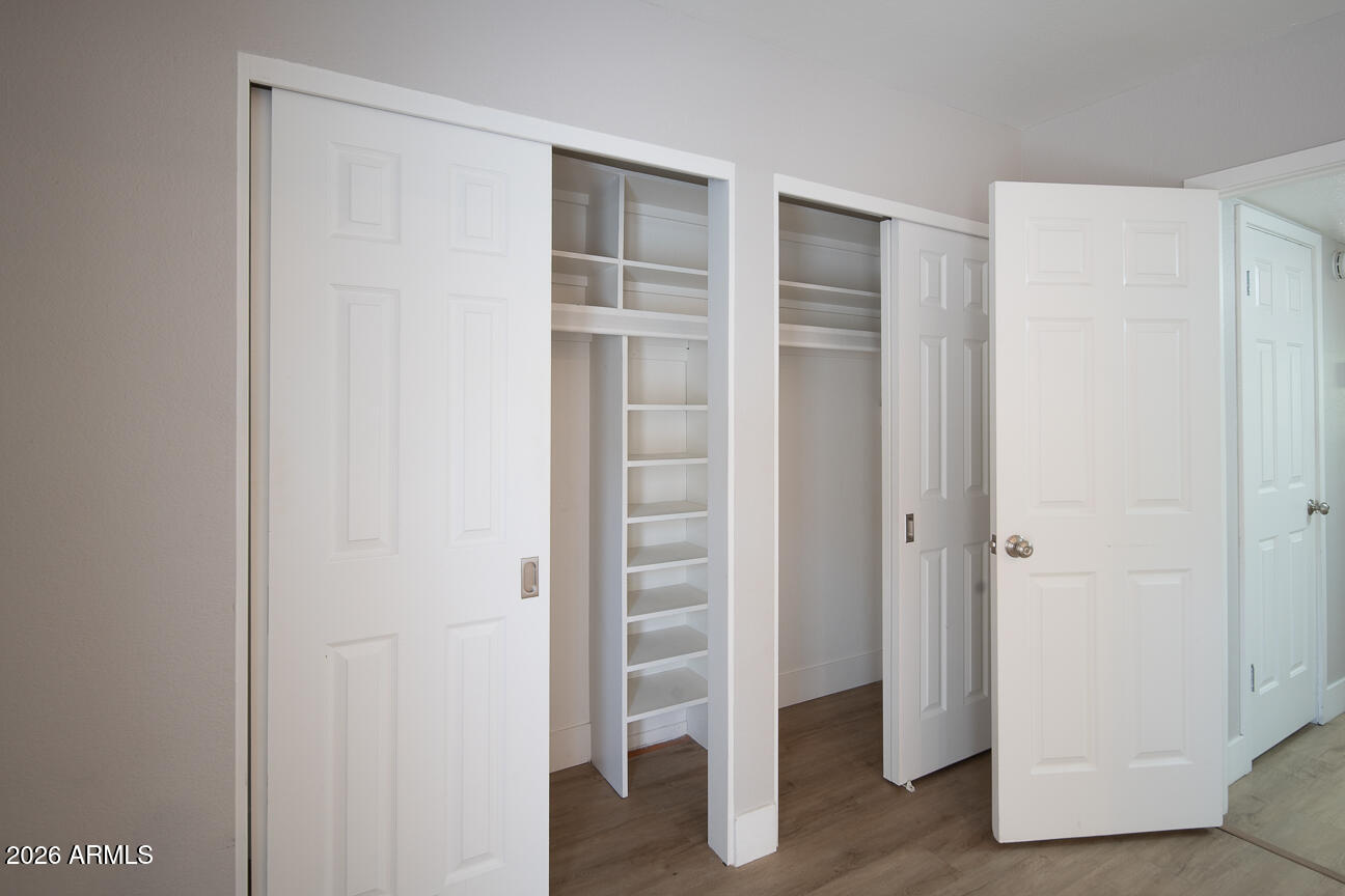 4540 North 44th Street, Unit 50 Phoenix, AZ 85018 - Photo 14 of 31 a view of walk in closet with empty racks