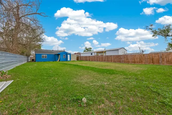 a view of a house with a back yard