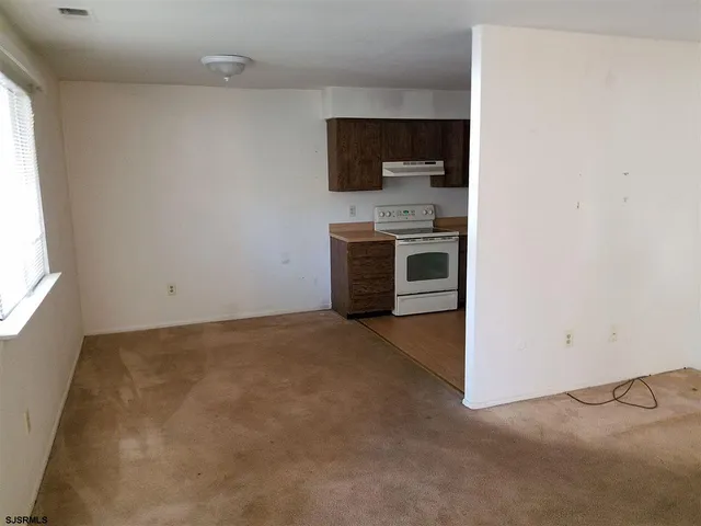 a view of a kitchen with a sink and a microwave