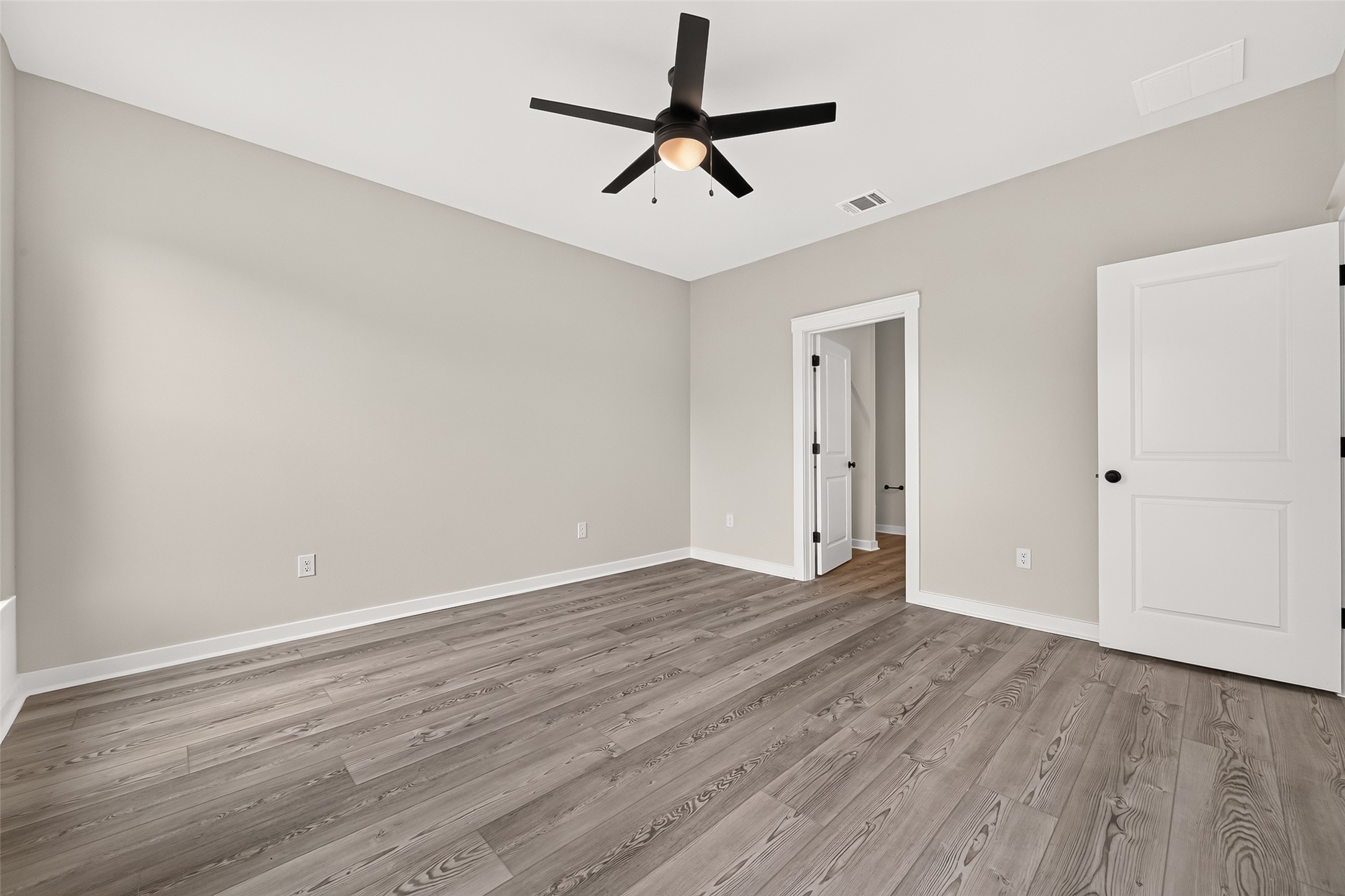 21122 Autumn Heights Rosharon, TX 77583 - Photo 23 of 42 a view of empty room with wooden floor