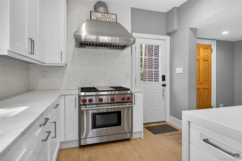 a kitchen with a stove and cabinets