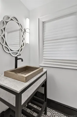 a bathroom with a sink and a mirror