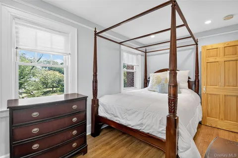 a bed room with a bed and a window