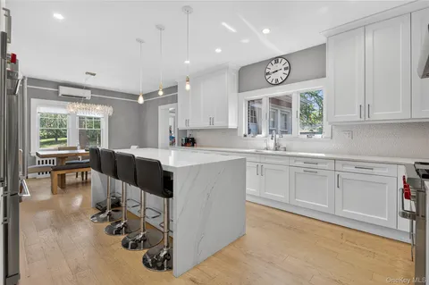 a kitchen with a sink cabinets and window