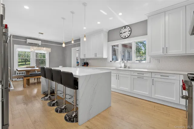 a kitchen with a sink cabinets and window