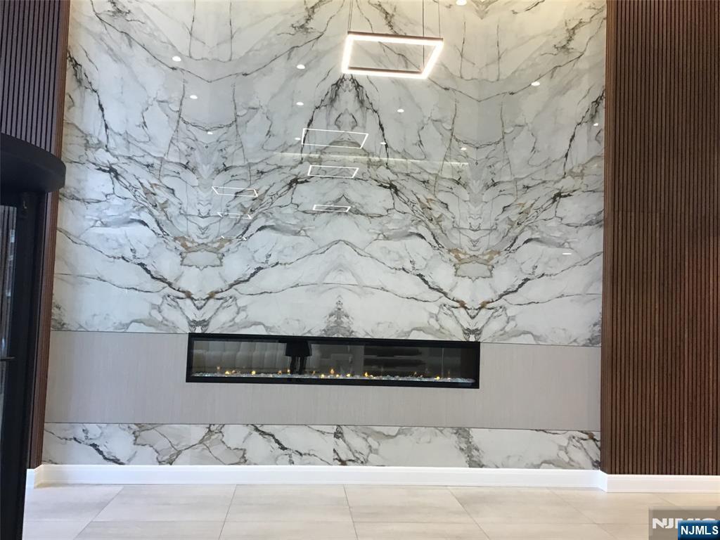 1203 River Road, Unit 21M Edgewater, NJ 07020 - Photo 12 of 12 a room with a rug