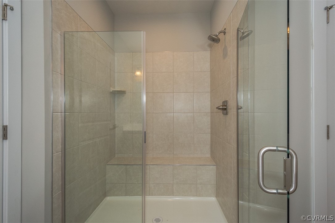 4100 Maze Runner Drive, Unit 406 Midlothian, VA 23112 - Photo 11 of 34 a bathroom with a shower and toilet