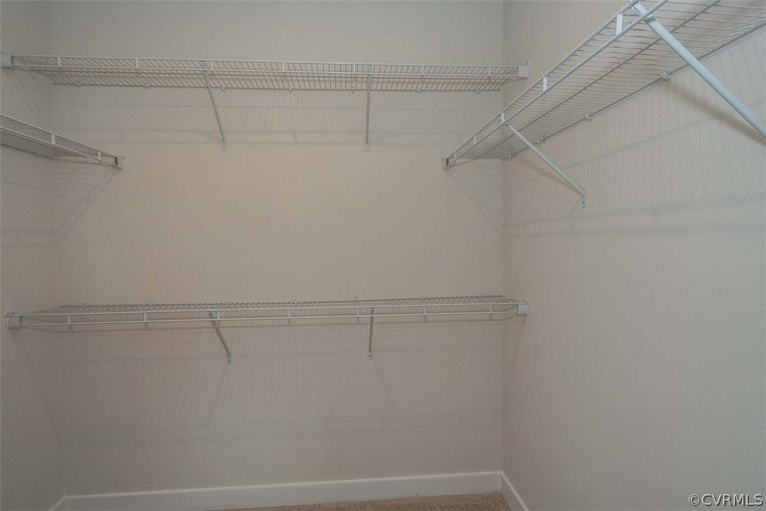 4100 Maze Runner Drive, Unit 406 Midlothian, VA 23112 - Photo 14 of 34 a view of a room with racks on the wall