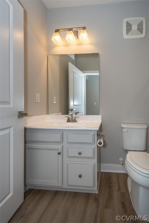 4100 Maze Runner Drive, Unit 406 Midlothian, VA 23112 - Photo 17 of 34 a bathroom with a sink vanity and a toilet