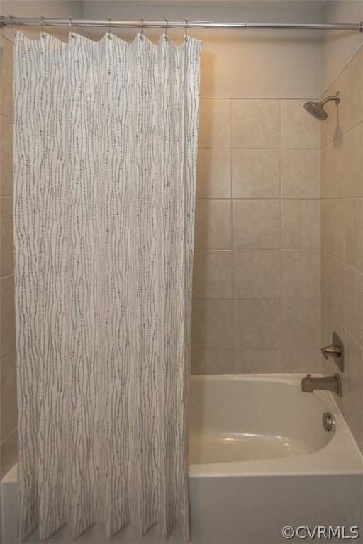 4100 Maze Runner Drive, Unit 406 Midlothian, VA 23112 - Photo 18 of 34 a bathroom with a bathtub