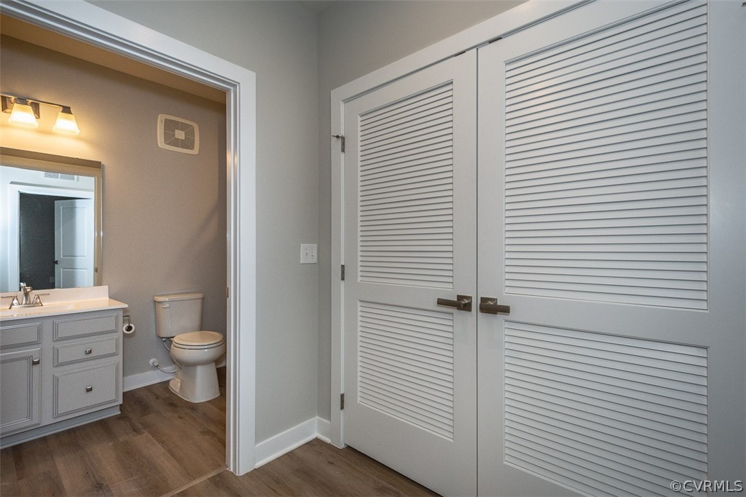 4100 Maze Runner Drive, Unit 406 Midlothian, VA 23112 - Photo 20 of 34 a bathroom with a granite countertop toilet and a sink