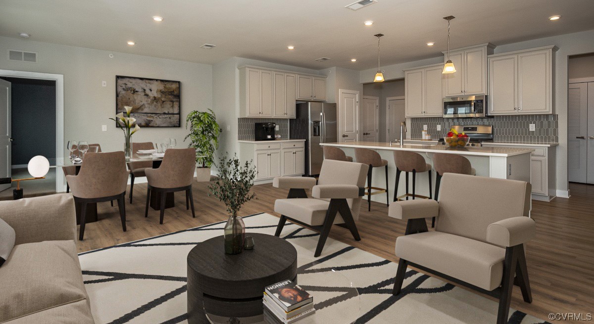 4100 Maze Runner Drive, Unit 406 Midlothian, VA 23112 - Photo 2 of 34 a living room with furniture a refrigerator and kitchen view