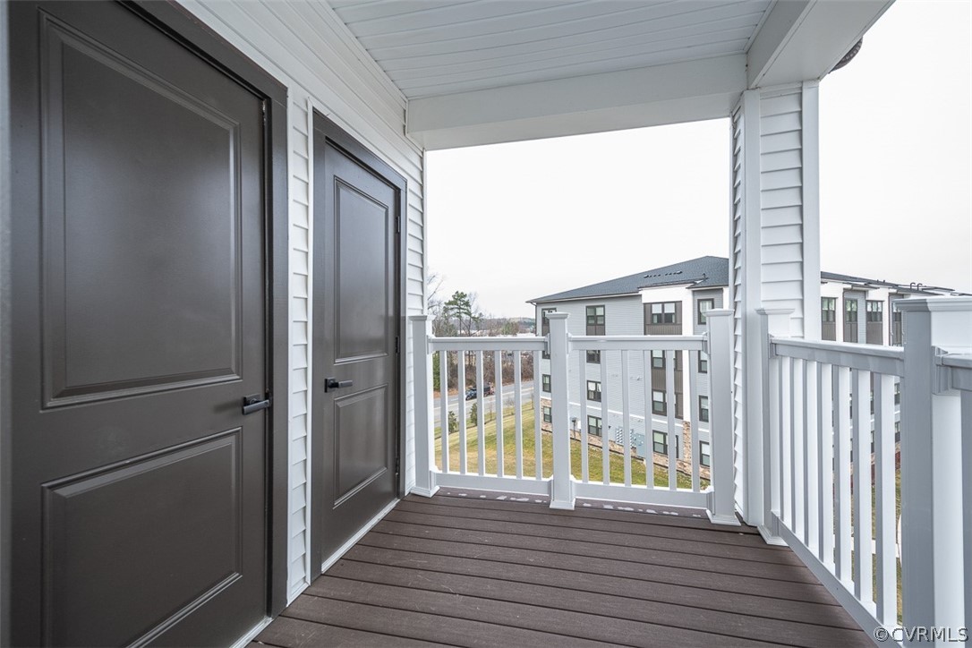 4100 Maze Runner Drive, Unit 406 Midlothian, VA 23112 - Photo 22 of 34 a view of a balcony with wooden floor