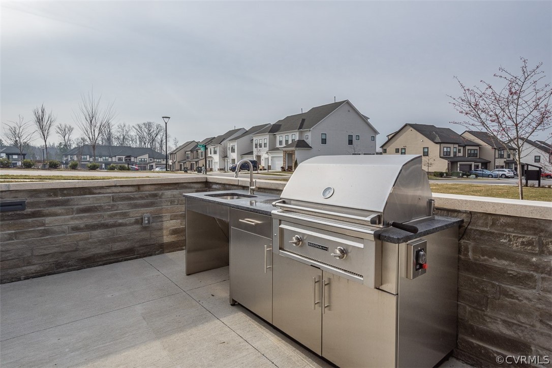 4100 Maze Runner Drive, Unit 406 Midlothian, VA 23112 - Photo 29 of 34 a stove top oven sitting inside of a kitchen