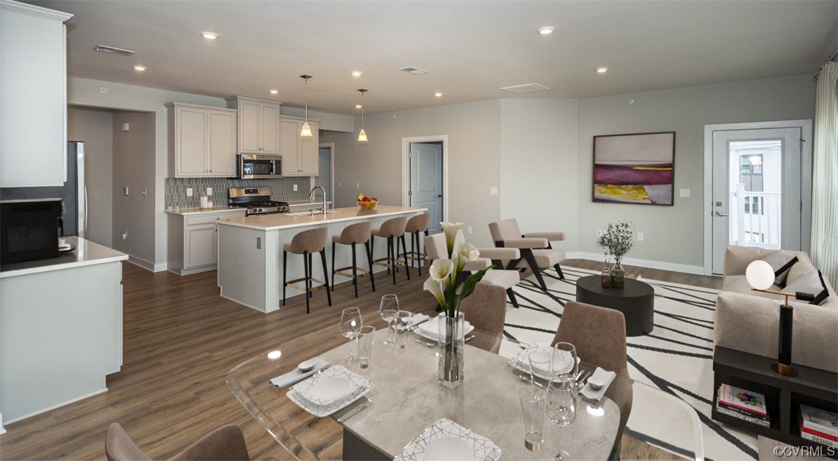 4100 Maze Runner Drive, Unit 406 Midlothian, VA 23112 - Photo 3 of 34 a large kitchen with a table and chairs