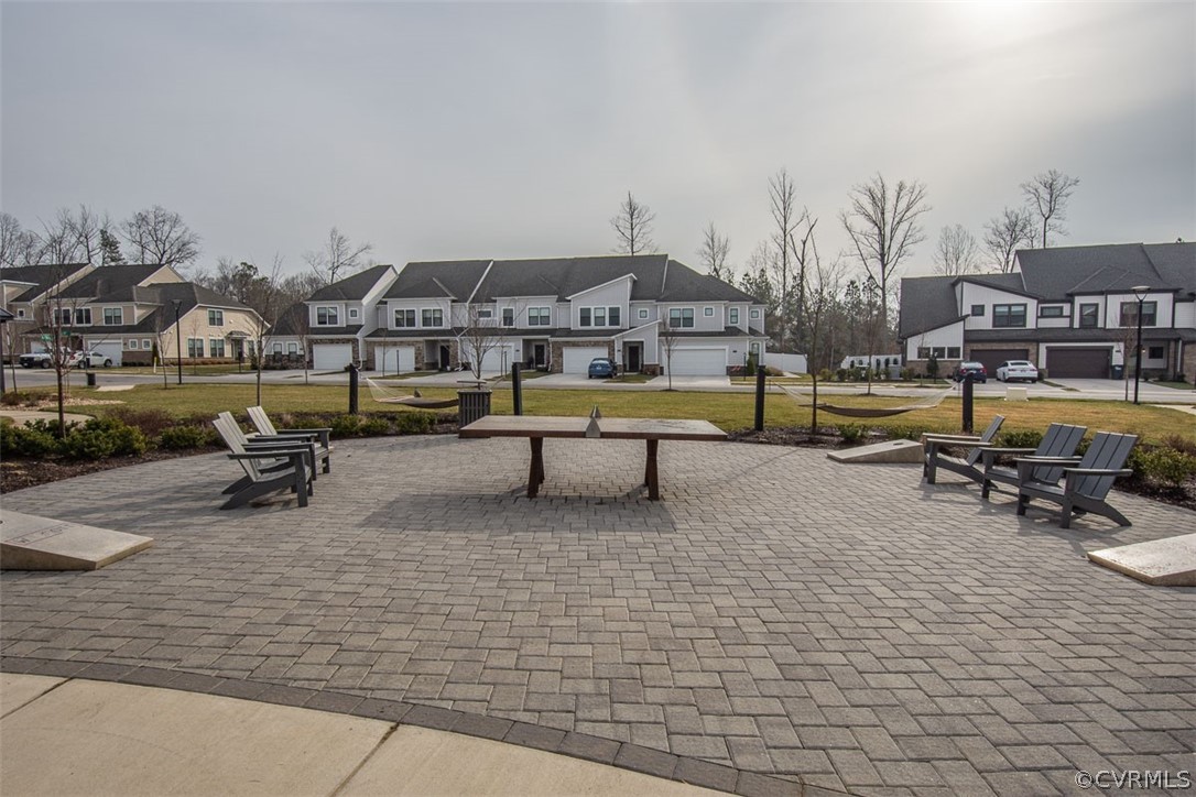 4100 Maze Runner Drive, Unit 406 Midlothian, VA 23112 - Photo 32 of 34 a view of a terrace with lawn chairs
