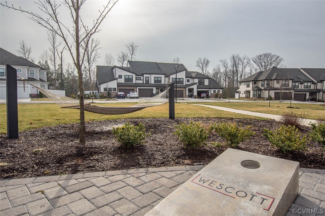 4100 Maze Runner Drive, Unit 406 Midlothian, VA 23112 - Photo 33 of 34 a front view of a house with a yard