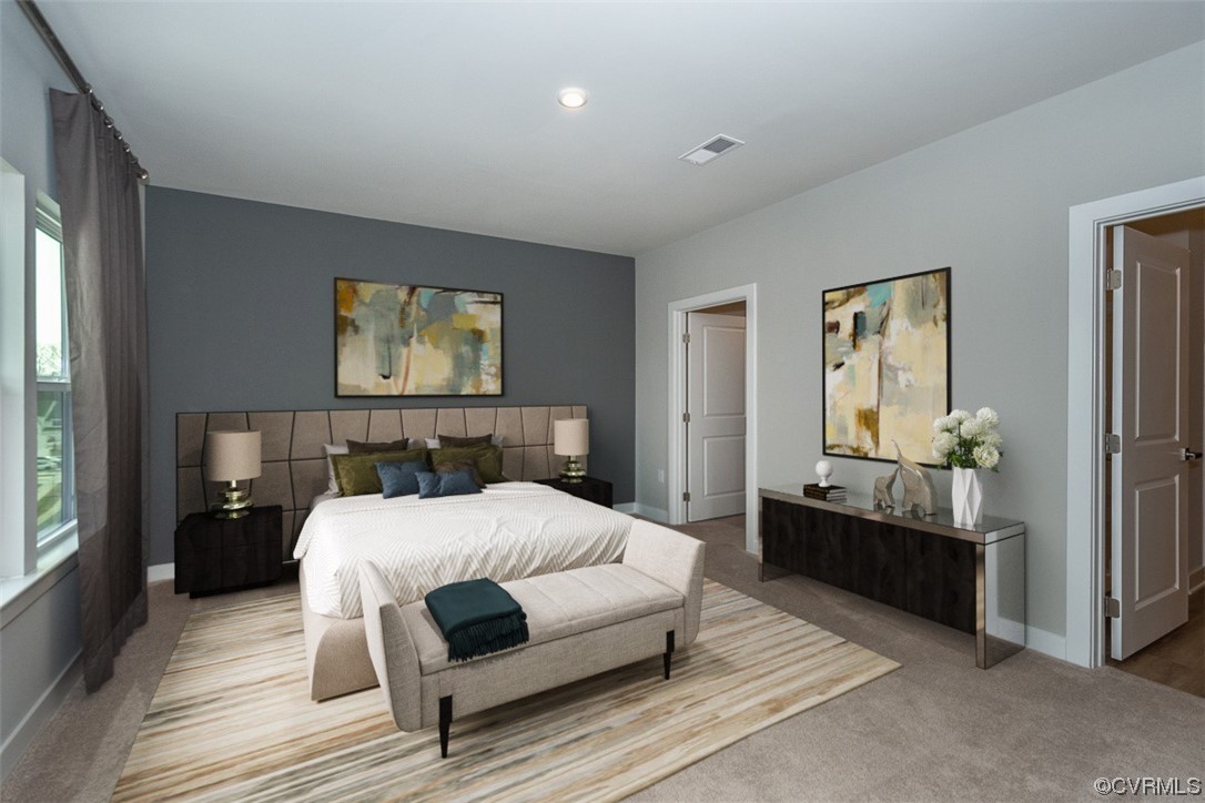 4100 Maze Runner Drive, Unit 406 Midlothian, VA 23112 - Photo 4 of 34 a bedroom with a bed and wooden floor