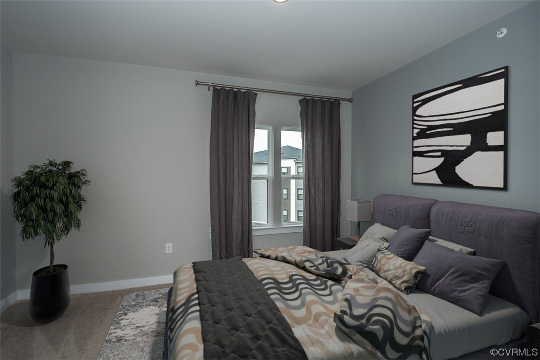 4100 Maze Runner Drive, Unit 406 Midlothian, VA 23112 - Photo 5 of 34 a bedroom with a bed and a potted plant