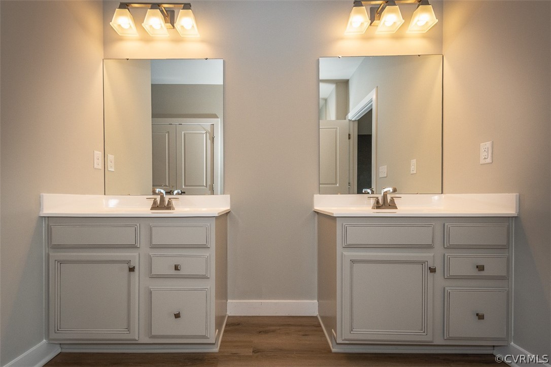 4100 Maze Runner Drive, Unit 406 Midlothian, VA 23112 - Photo 10 of 34 a bathroom with double vanity sink and a mirror