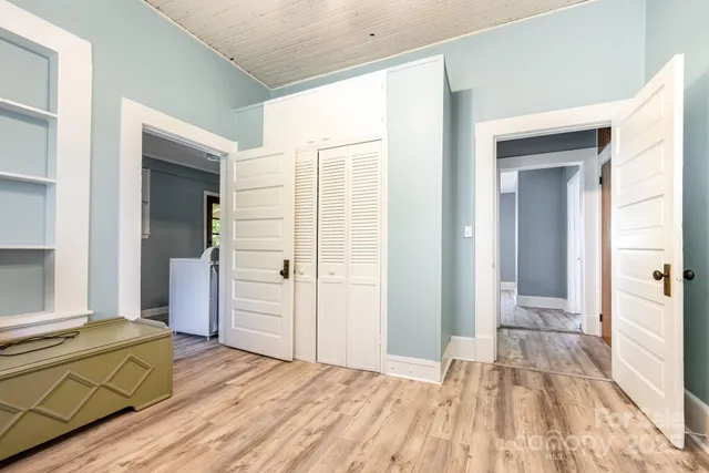a view of a livingroom with wooden floor