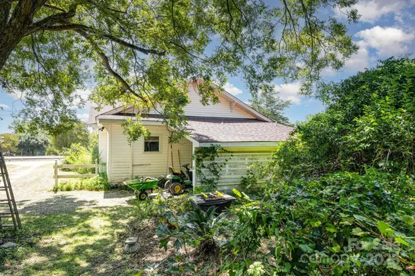 a front view of house with yard and swimming pool