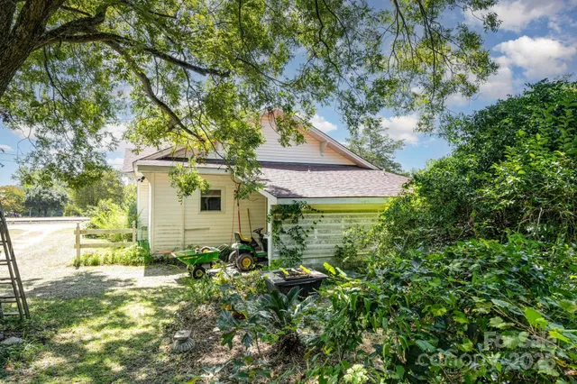 a front view of house with yard and swimming pool