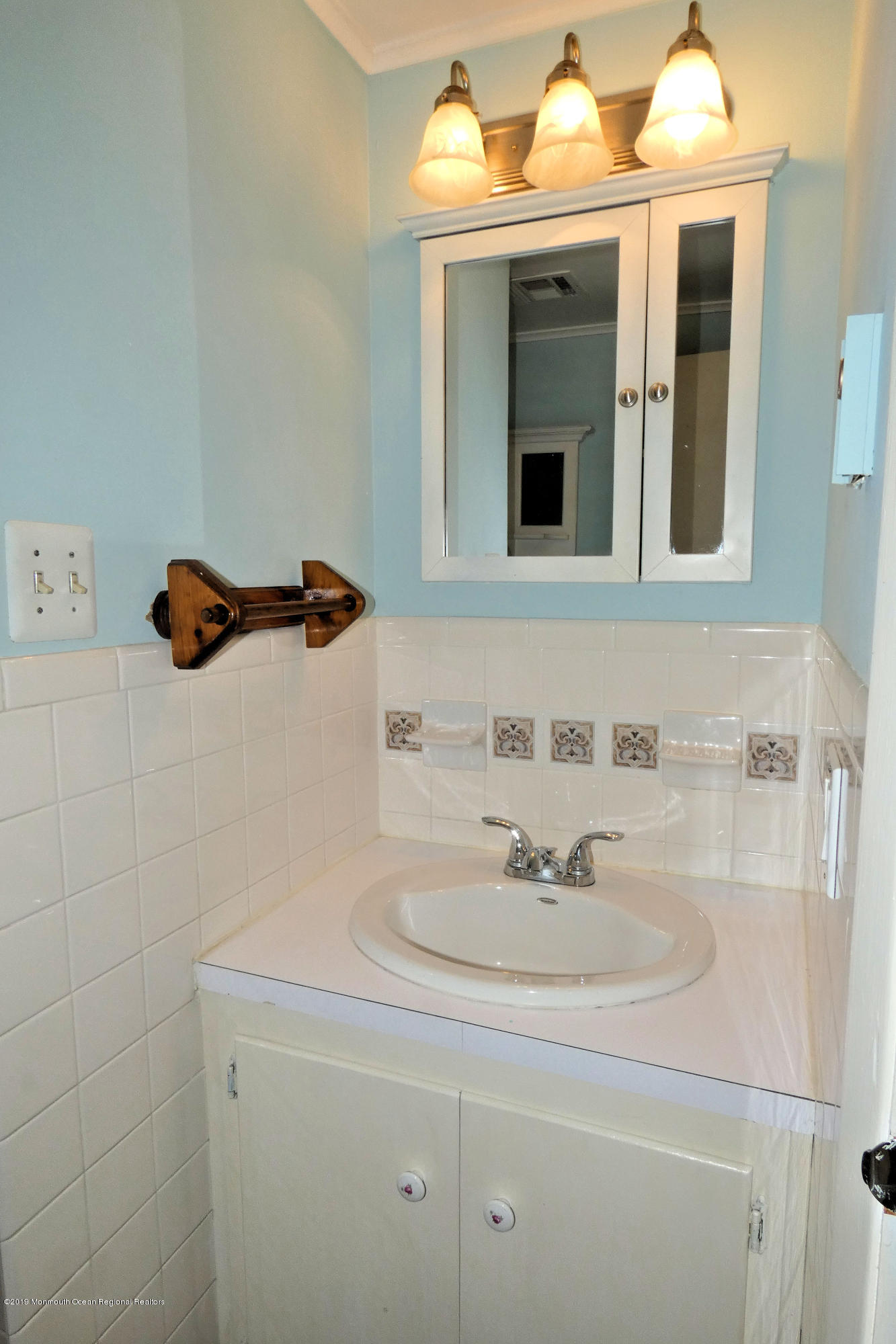 44 Las Vegas Road Lavallette, NJ 08735 - Photo 12 of 18 a bathroom with a sink and a mirror